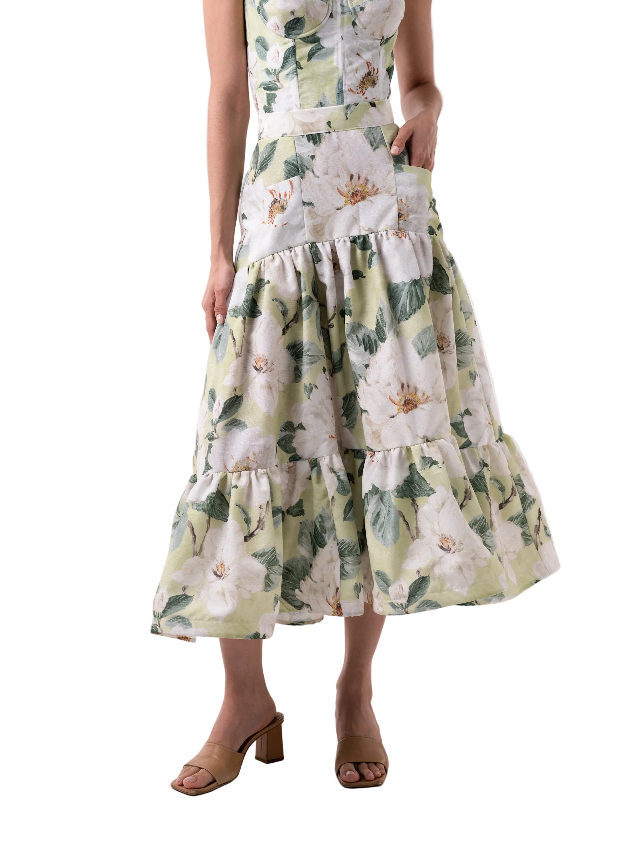 Skirt that features a high waisted ankle length silhouette, front pockets, with back zipper closure, and rushed two-tiered paneled skirt.
