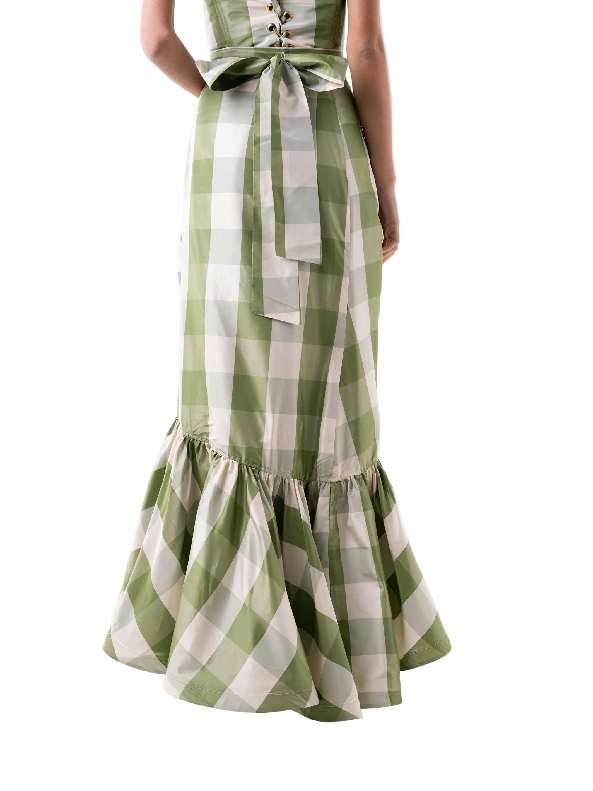 Skirt that features a wrap around floor length silhouette with circular ruffle below the knee.