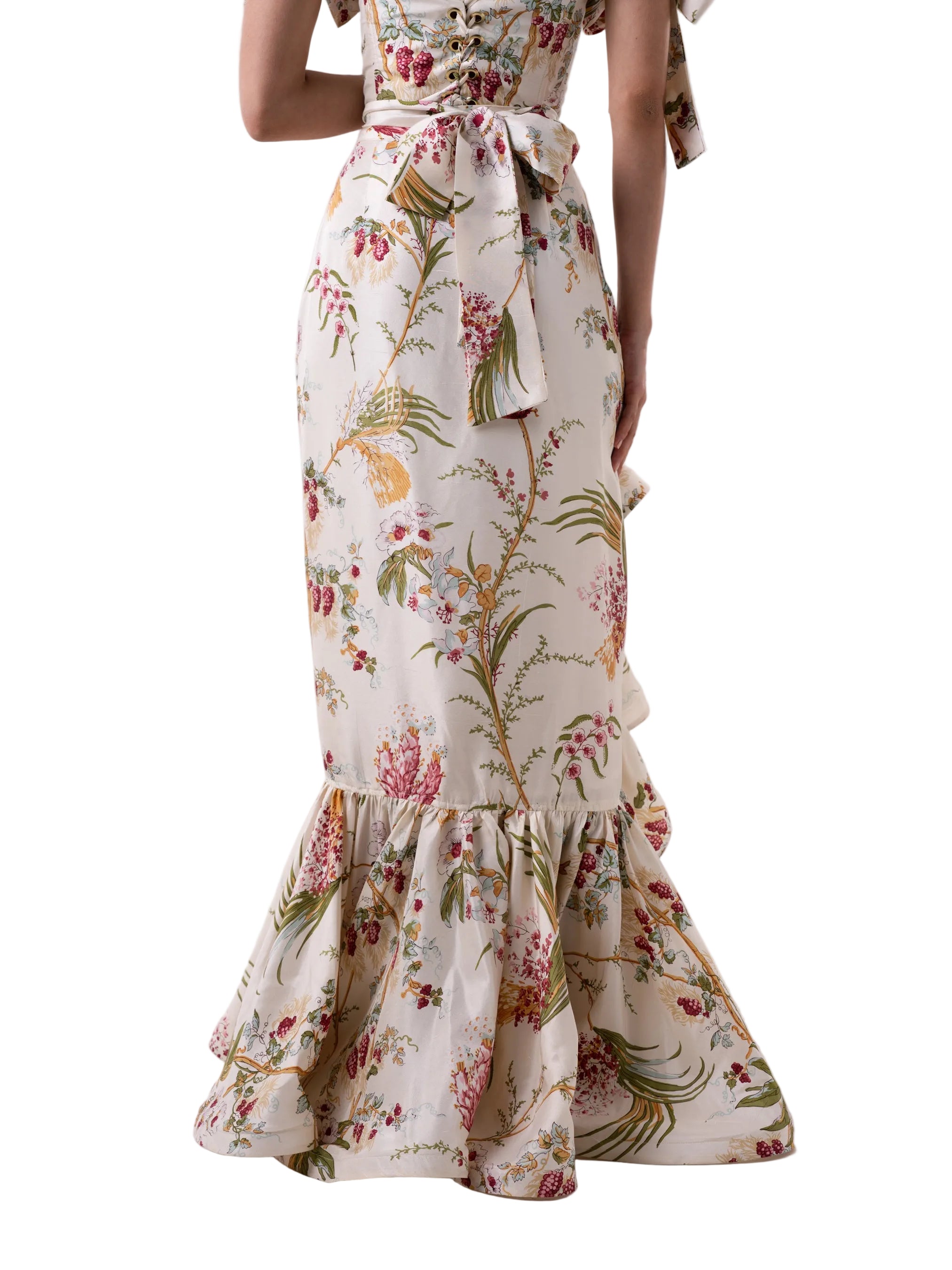 Skirt that features a wrap around floor length silhouette with circular ruffle down the center and hem.