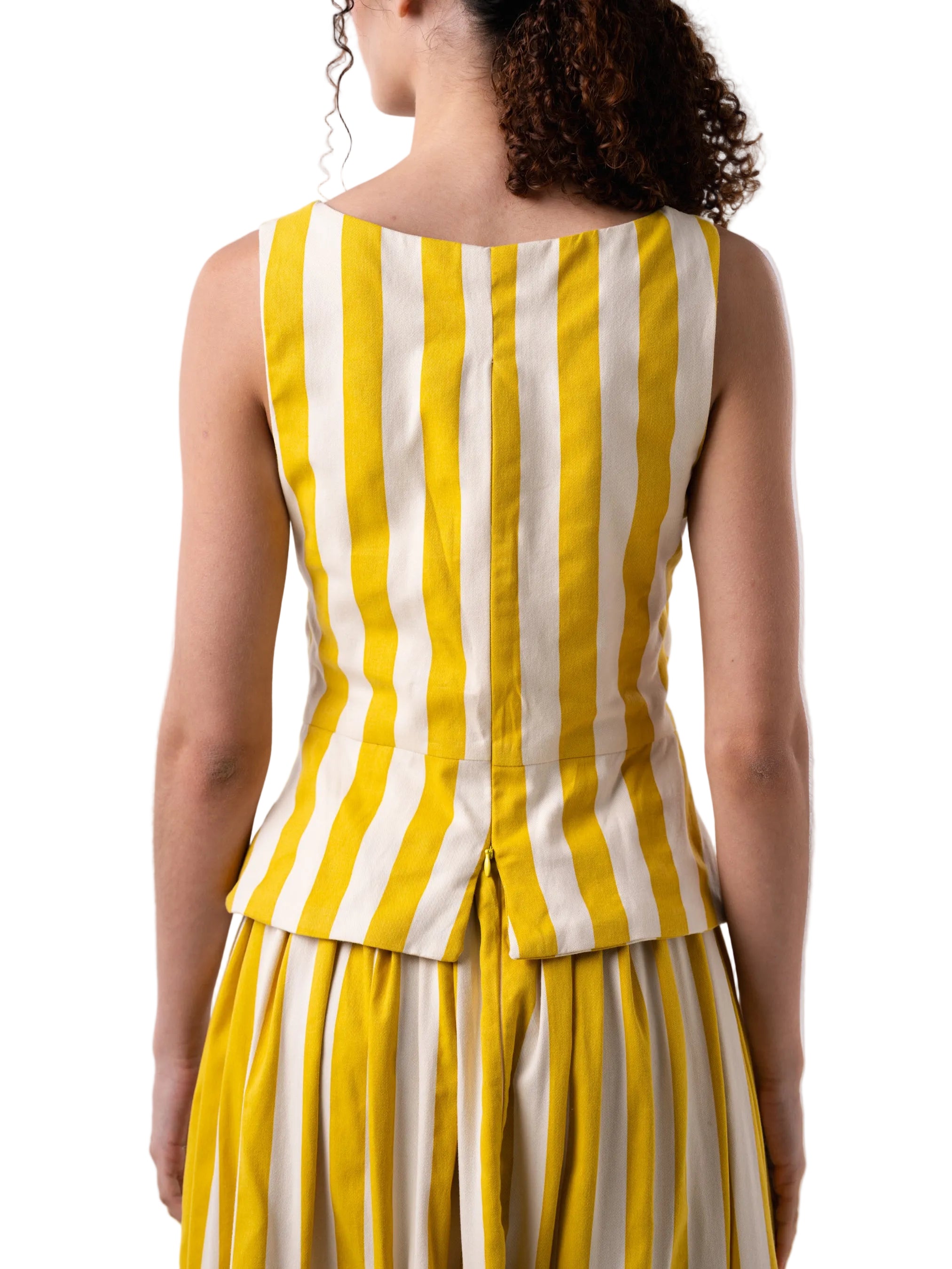 Top that features a V Neck silhouette with cut out details at the torso, finished with two knots and back zipper closure.