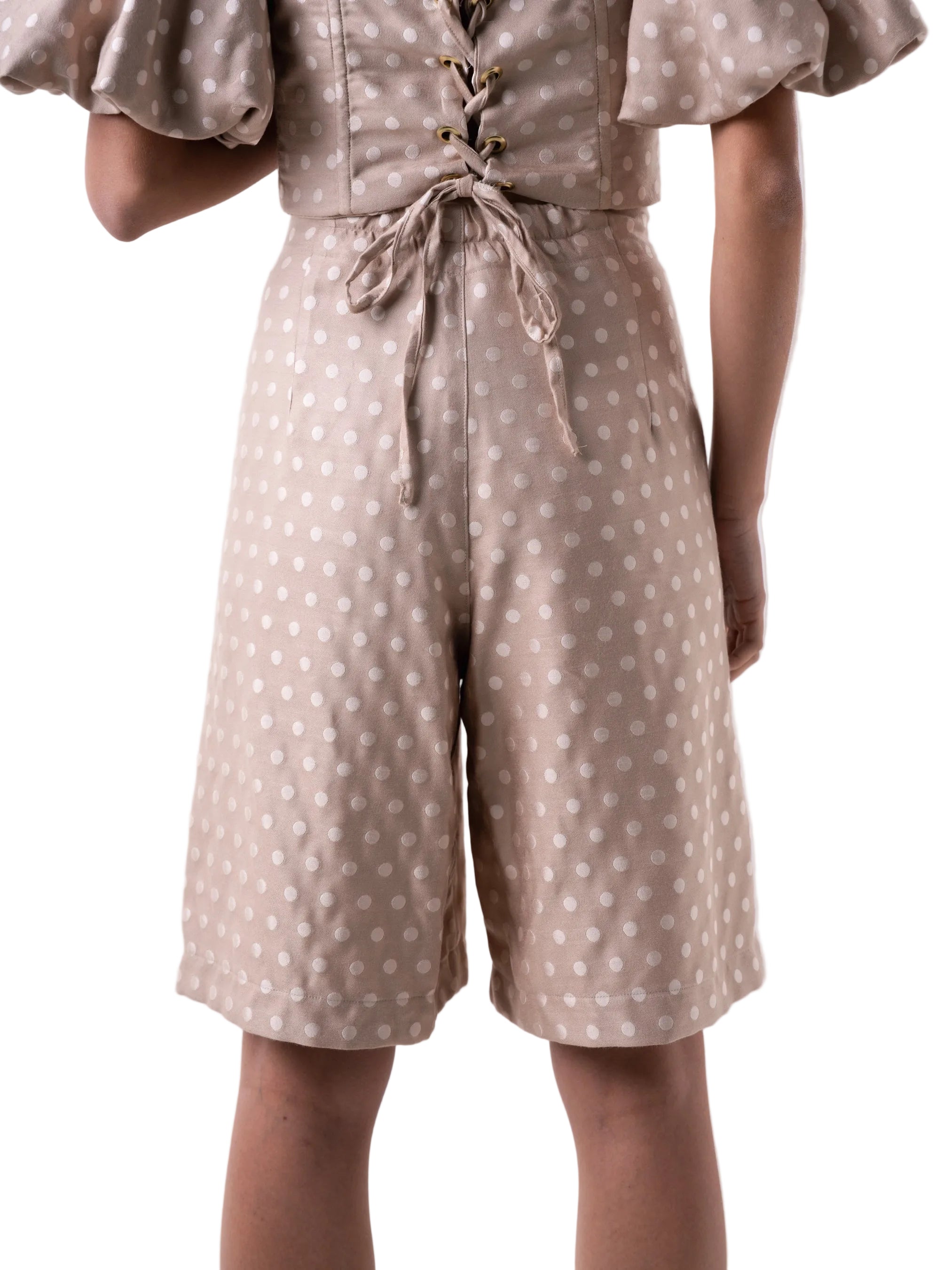 Bermudas that feature a high waisted silhouette with front pleats, and wide leg cut.