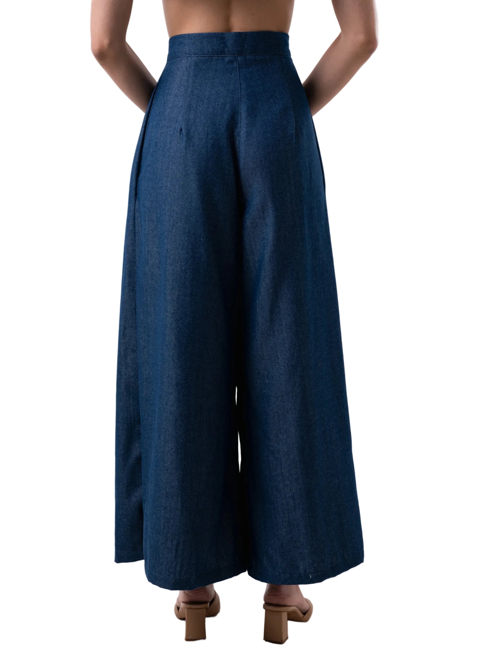 Navy palazzo silhouette with front pleats and side pockets.