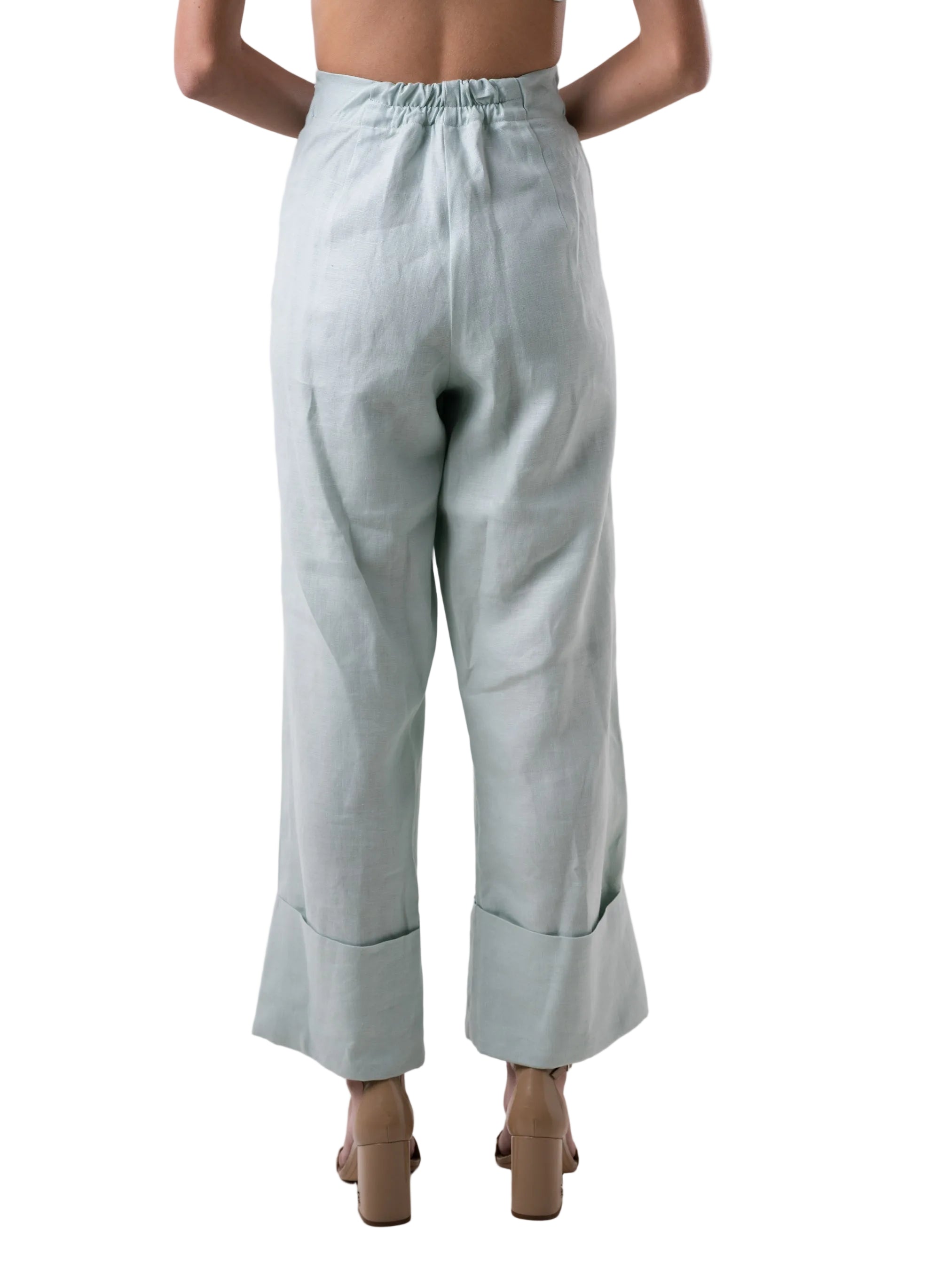 High waisted wide leg silhouette pant, with oversized cuff at the hem, front pockets.