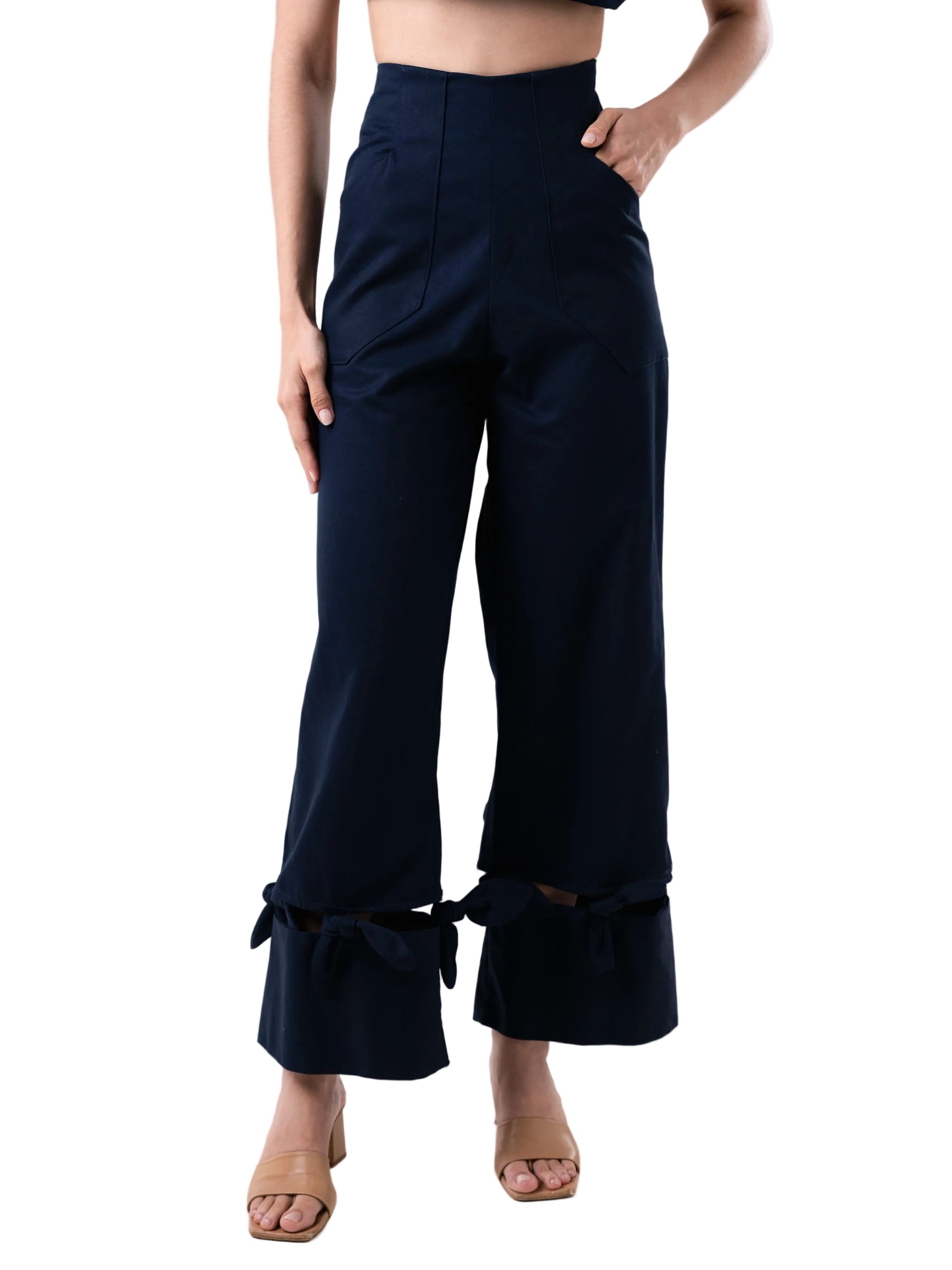 Navy pant with a high-waisted, wide-leg silhouette with bow details at the hem.