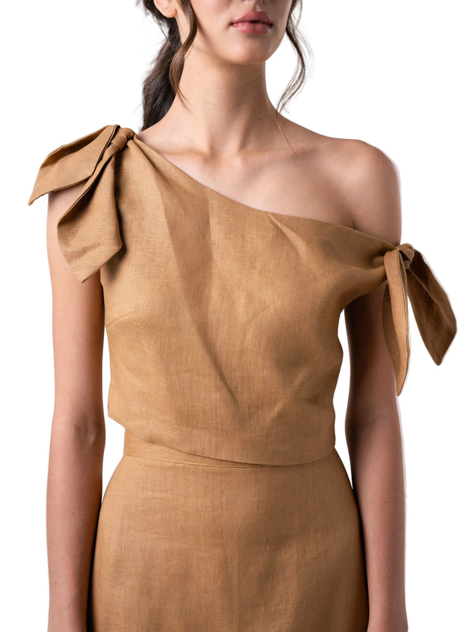 Top that features a cropped loose silhouette with dropped shoulders detail, and back zipper closure.