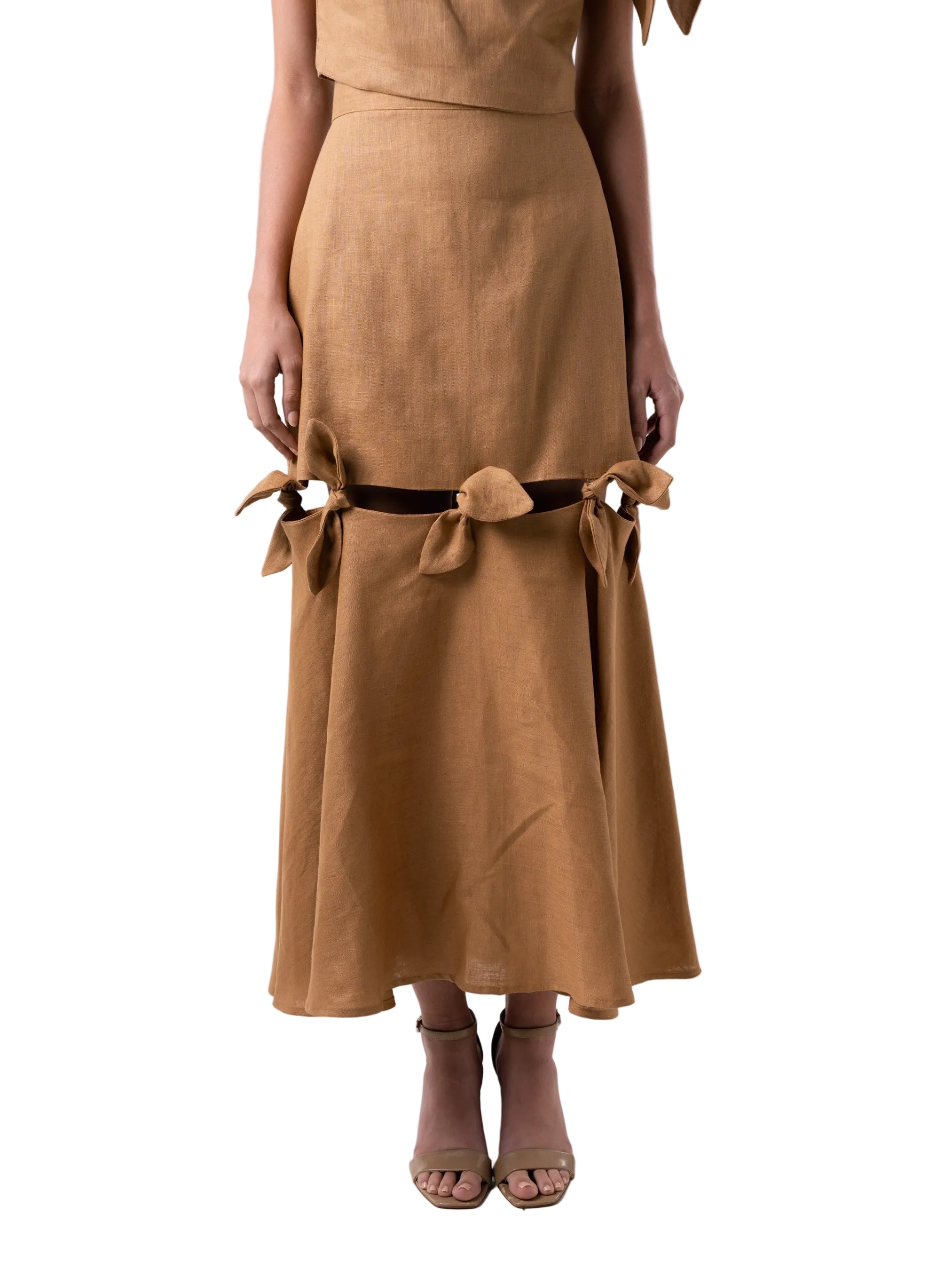 Fit and flare high waisted below the knee skirt, with exposed cutout and knot details that attach the fitted body to the flared panel, with back zipper closure.