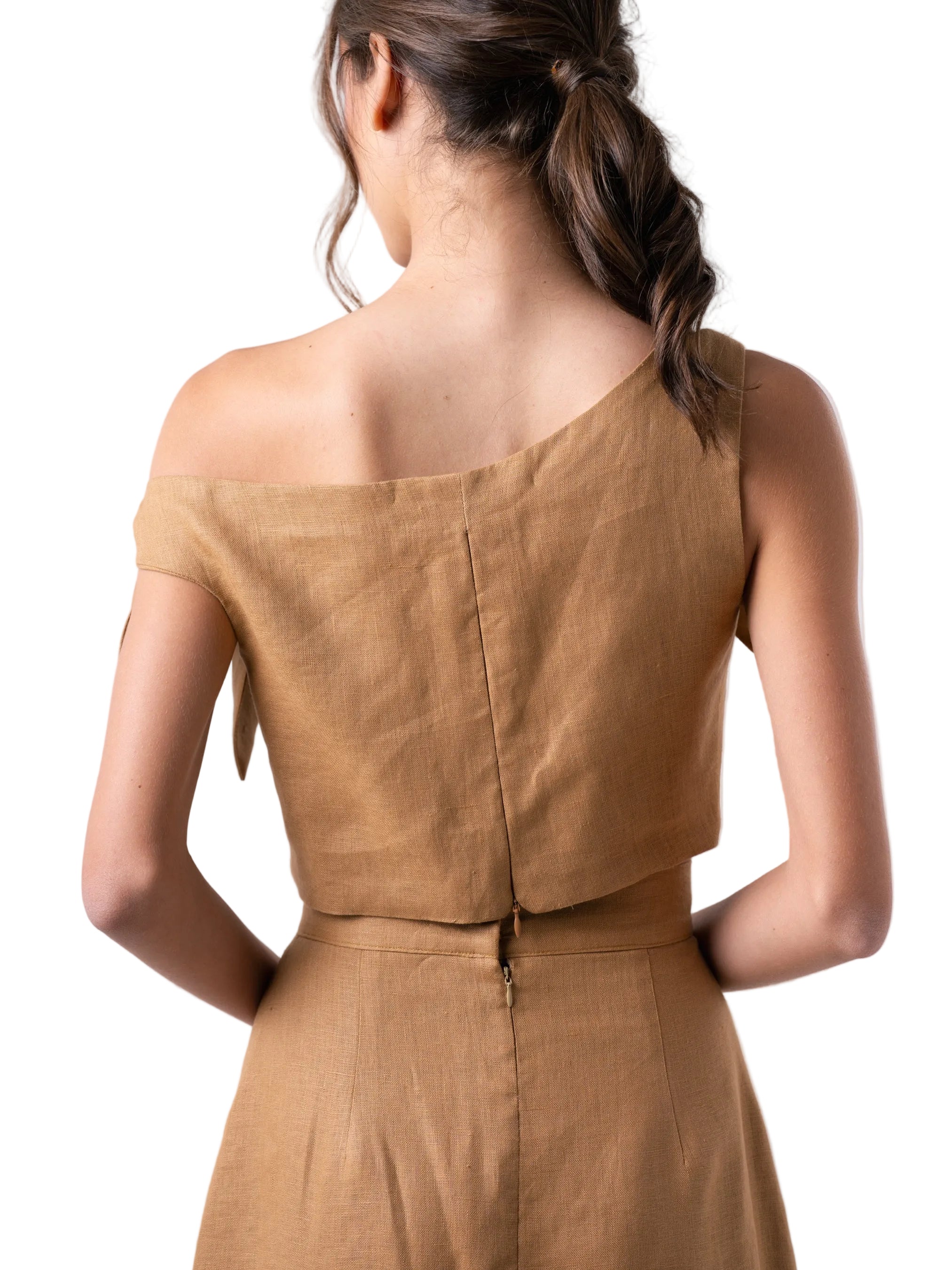 Top that features a cropped loose silhouette with dropped shoulders detail, and back zipper closure.