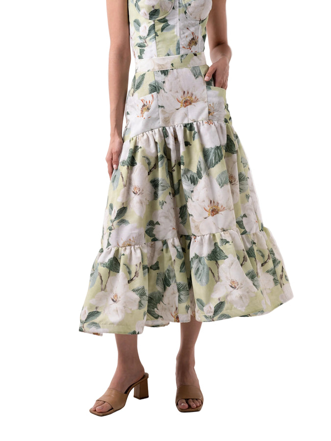 Skirt that features a high waisted ankle length silhouette, front pockets, with back zipper closure, and rushed two-tiered paneled skirt.