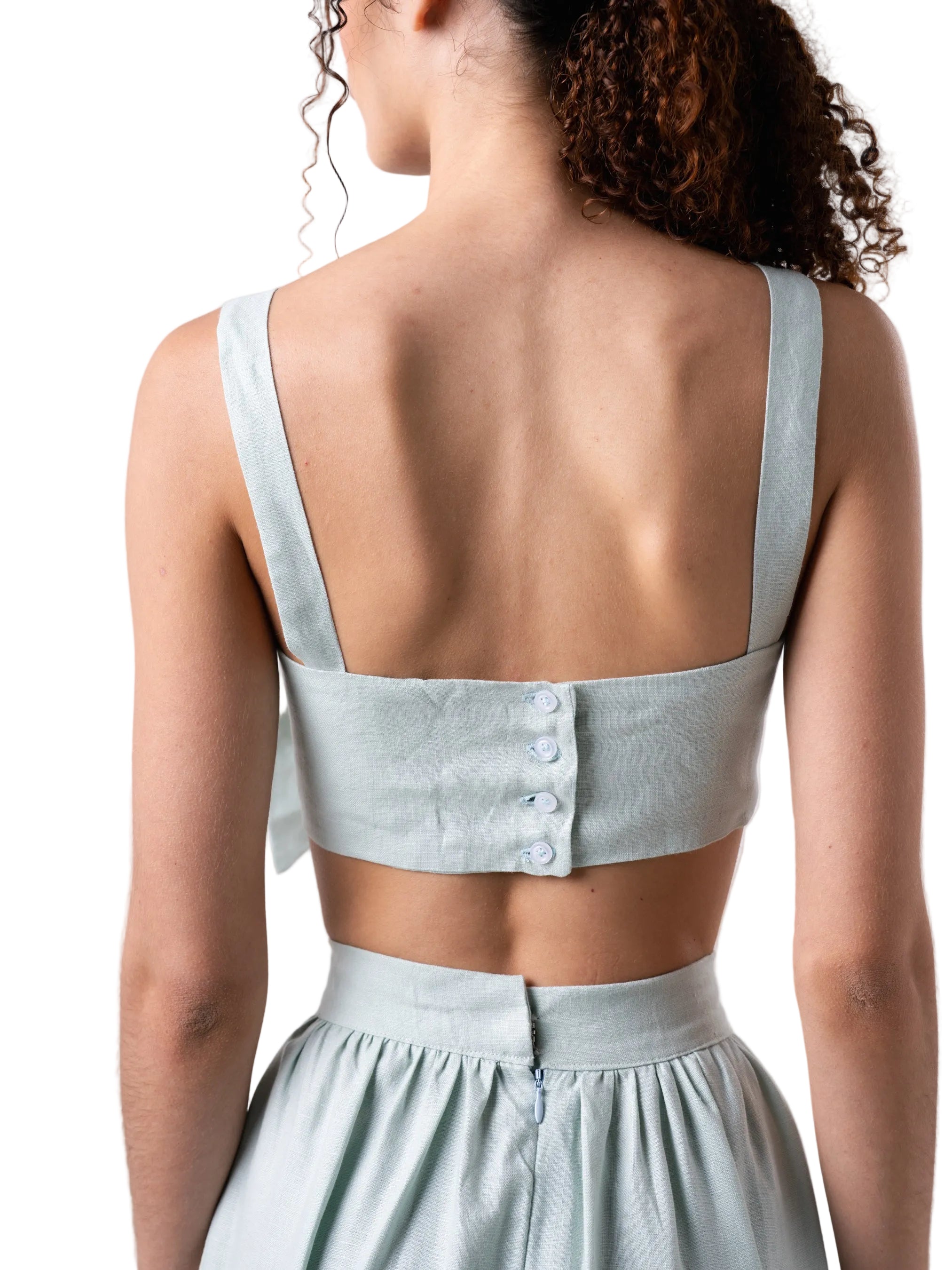Bandeau style top with oversized knot detail at the front, straps and button closure down the back.
