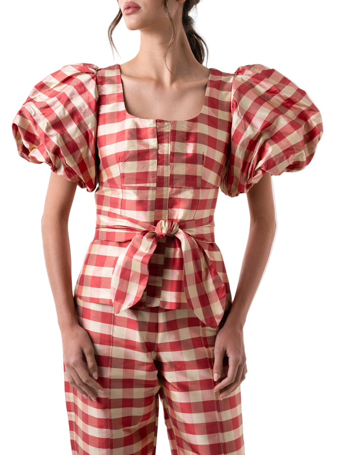 Top that features a square neck with puff sleeves, fitted silhouette with front hidden placket closure. 