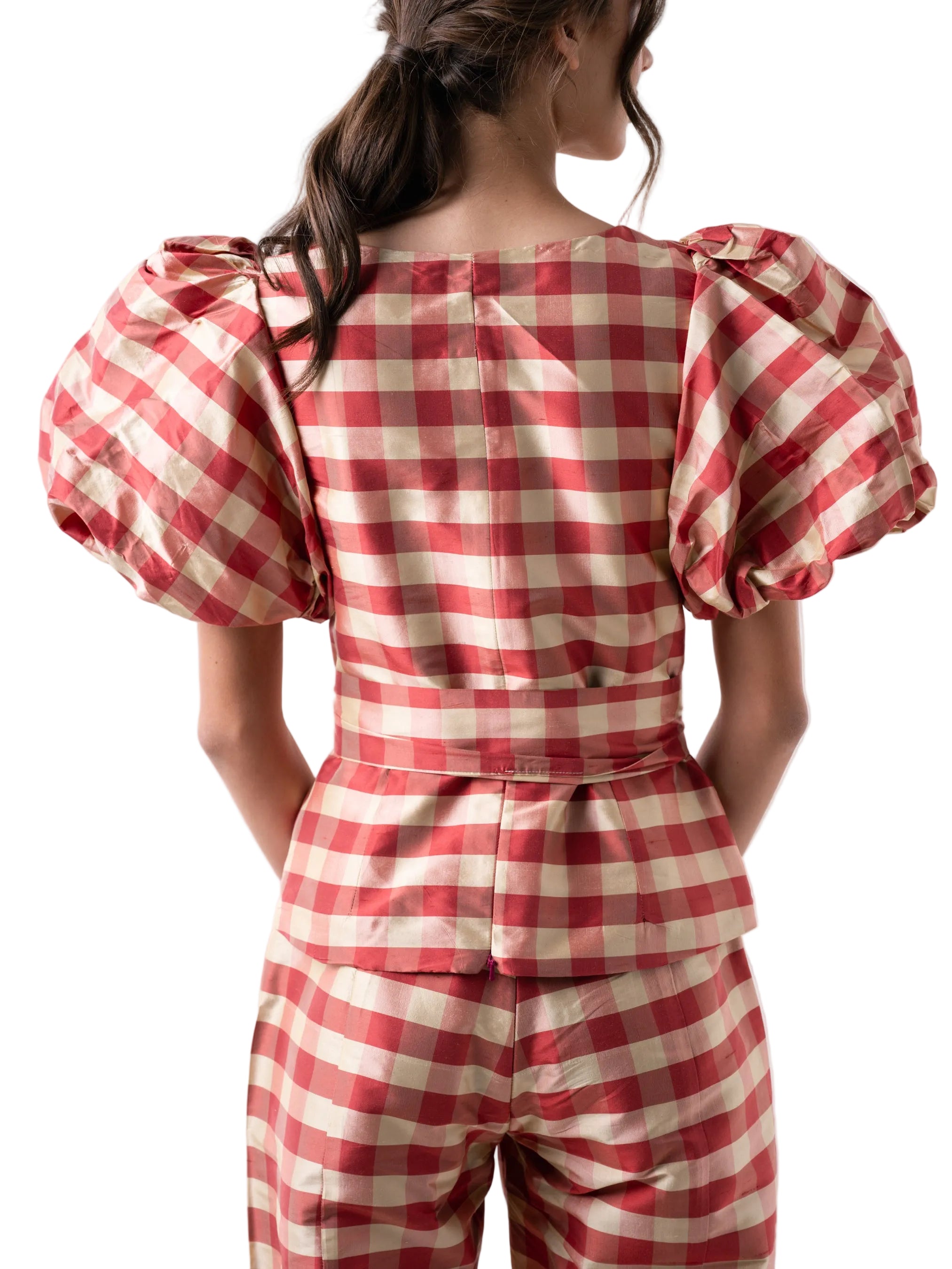 Top that features a square neck with puff sleeves, fitted silhouette with front hidden placket closure. 