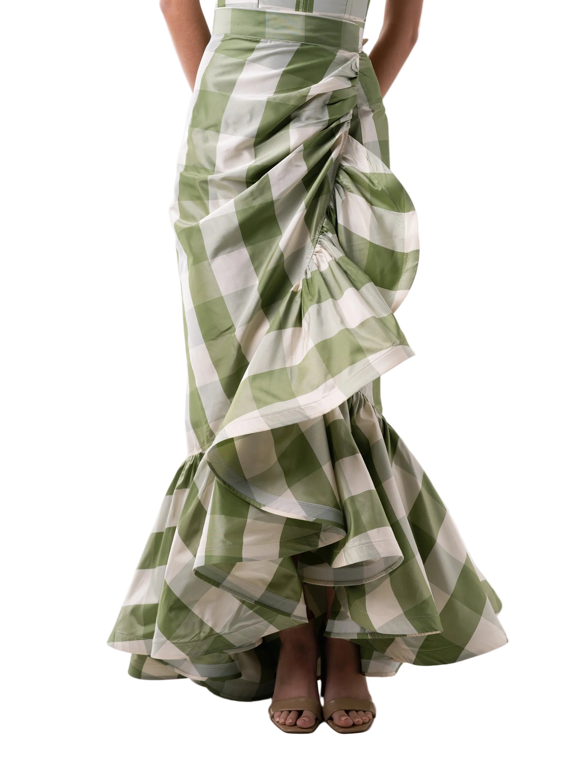 Skirt that features a wrap around floor length silhouette with circular ruffle below the knee.