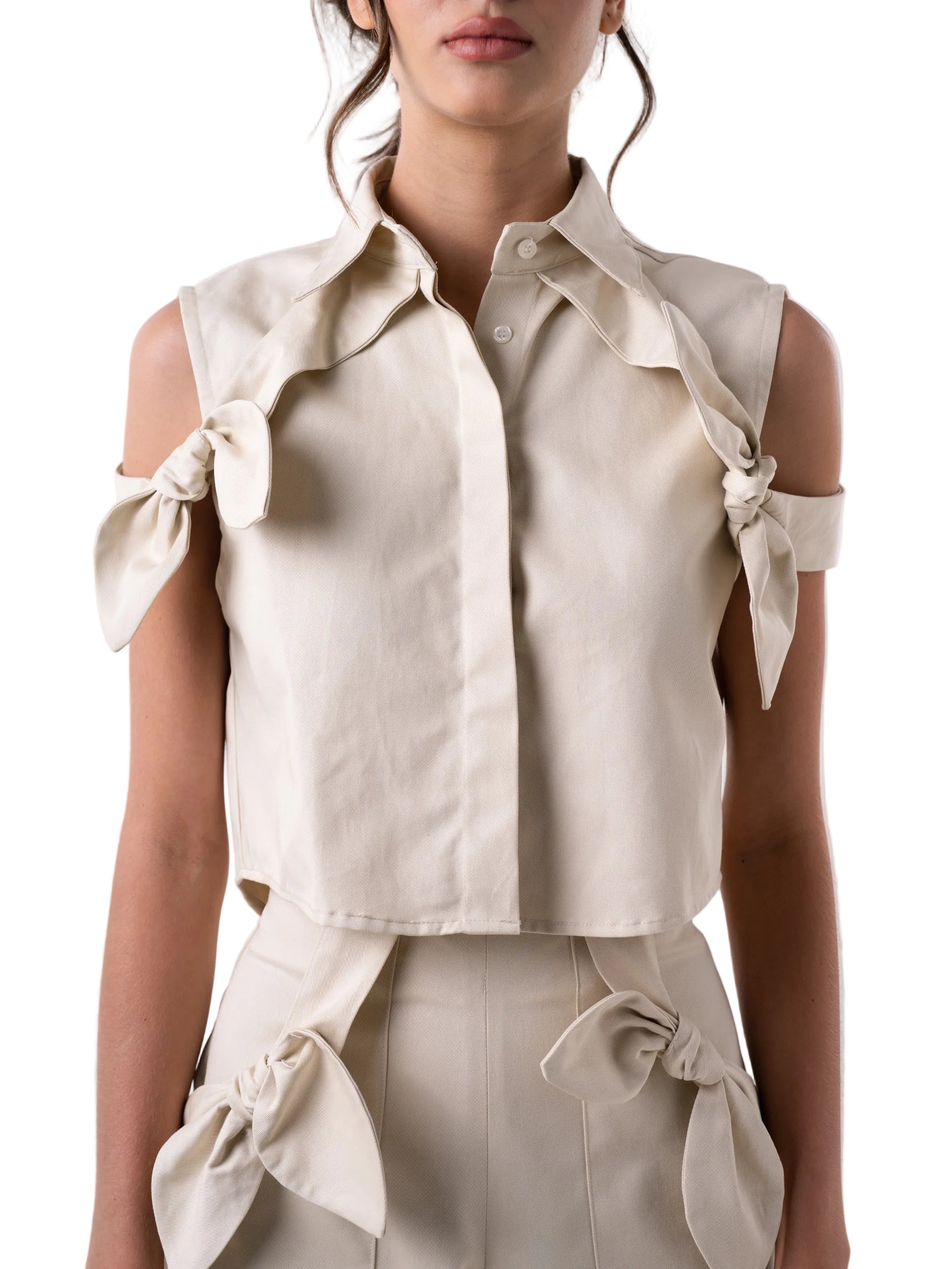 Boxy cropped top silhouette with collar and front placket, with off the shoulder straps.