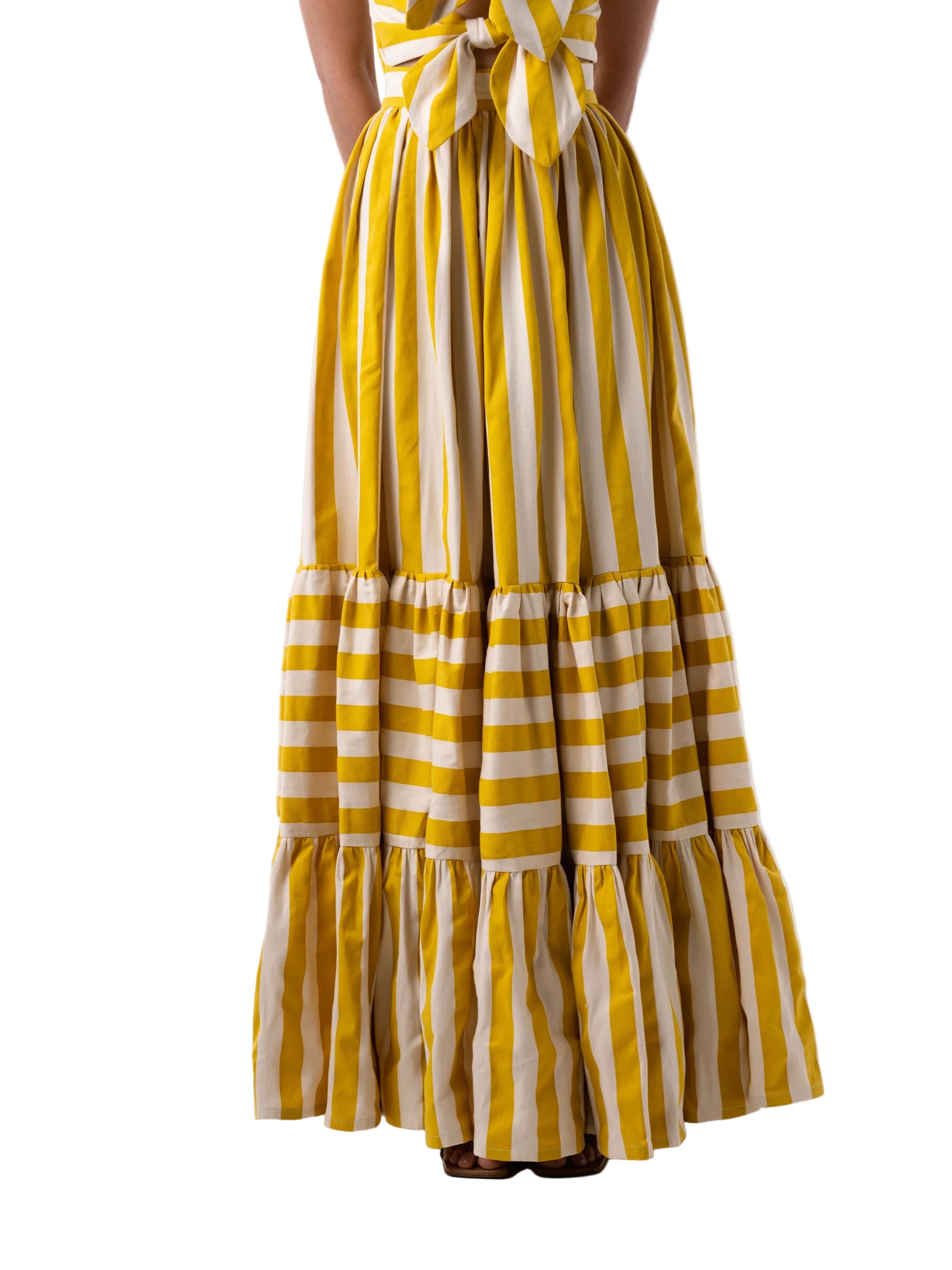 Skirt that features an A-Line three-tiered gathered floor length skirt with zipper closure.