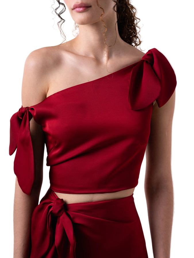 Top that features a cropped loose silhouette with dropped shoulders detail, and back zipper closure.