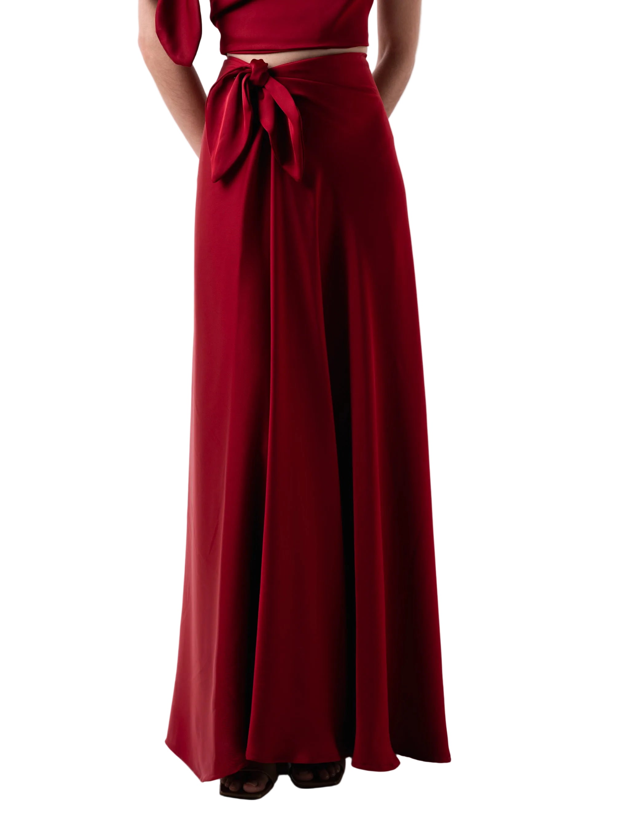 Skirt that features a high waisted A-Line silhouette with front gather and front petal knot detail.
