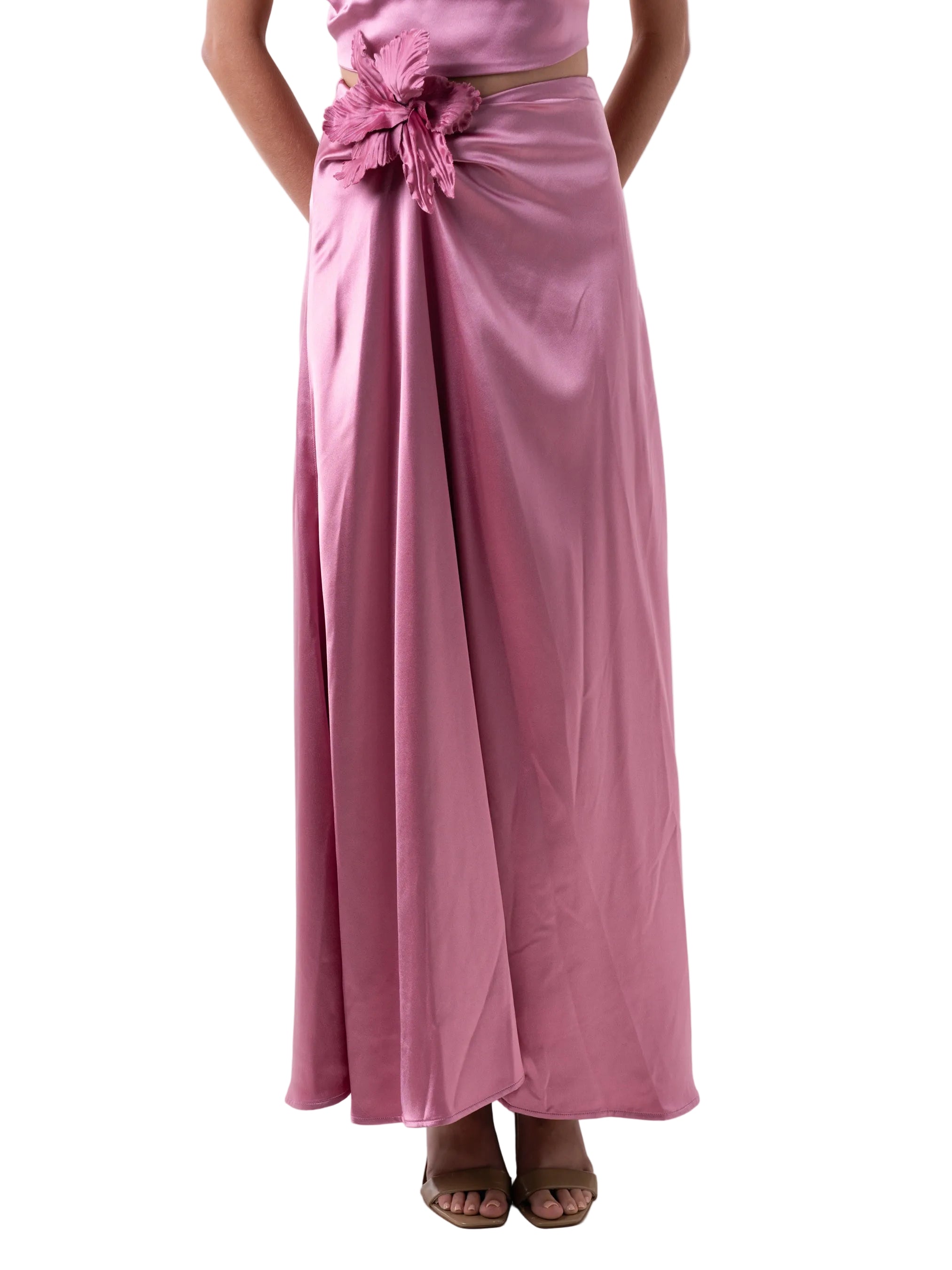 Skirt that features a high waisted A-Line silhouette with front gather and fabric flower detail.
