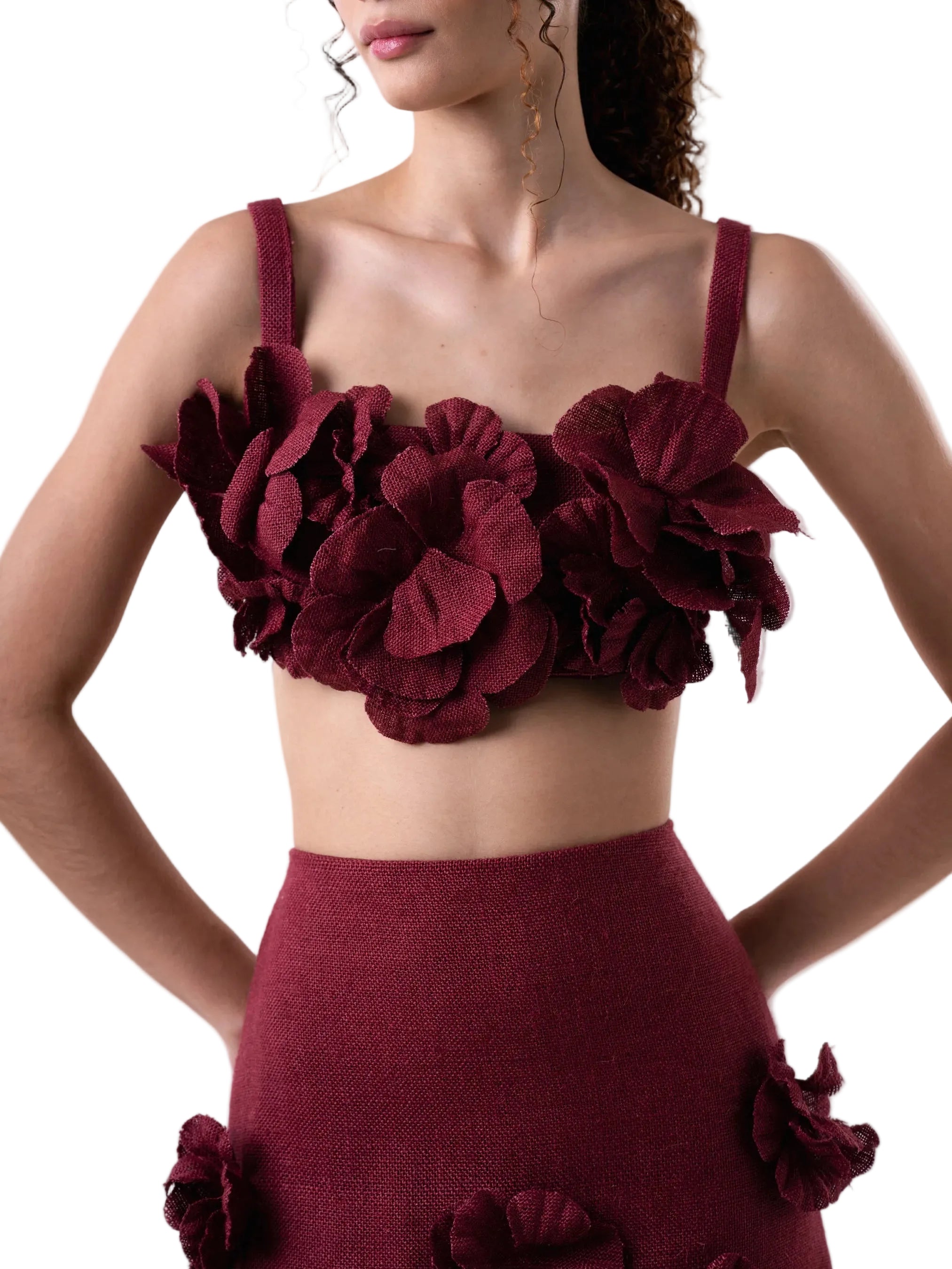 Cropped top with straps, hand sewn artisanal flower details and back button closure.