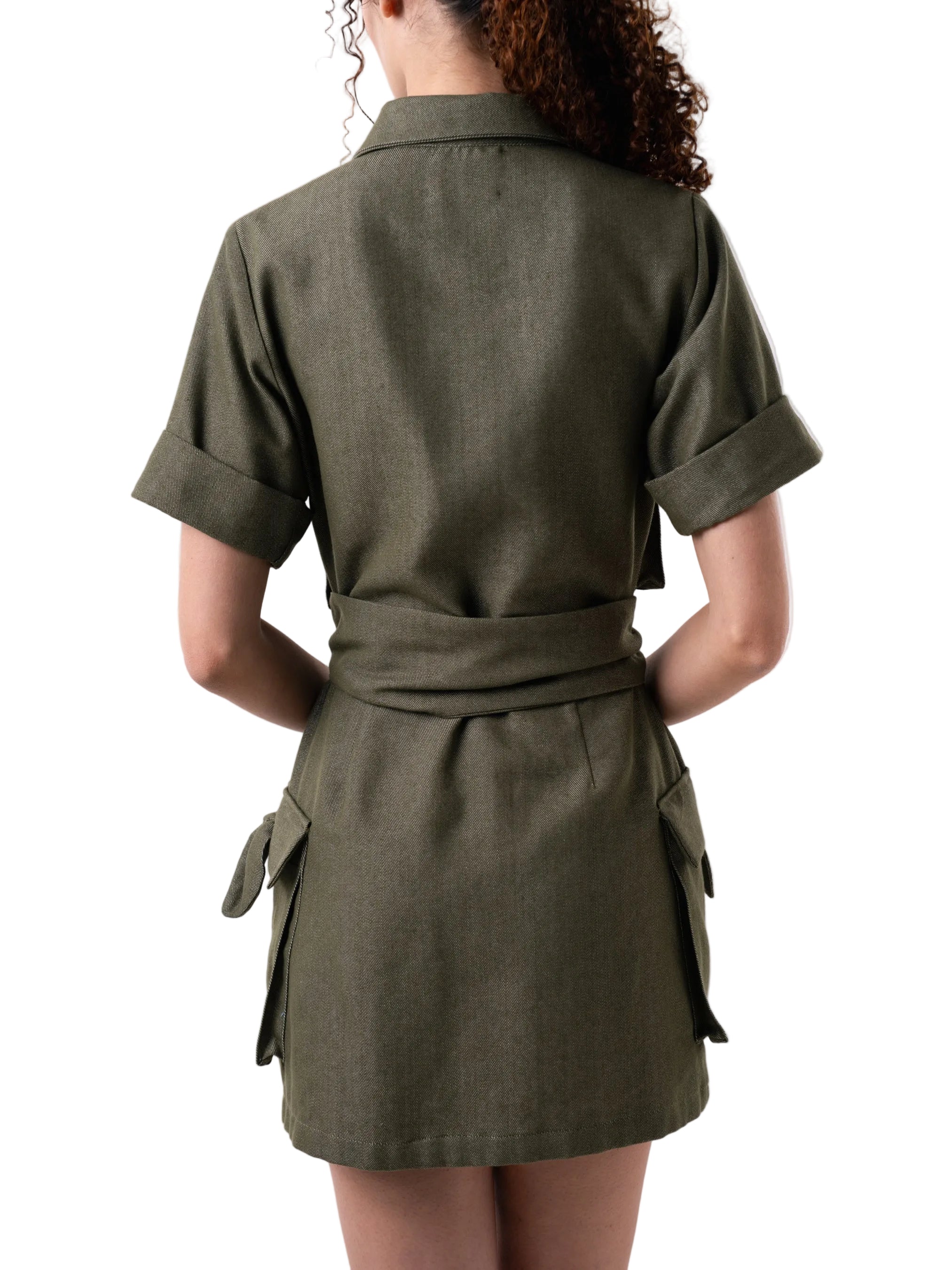 Dress features a short above the knee relaxed silhouette, short sleeves, body is adorned with oversized pockets with knot detail, button down closure and a matching belt for styling.