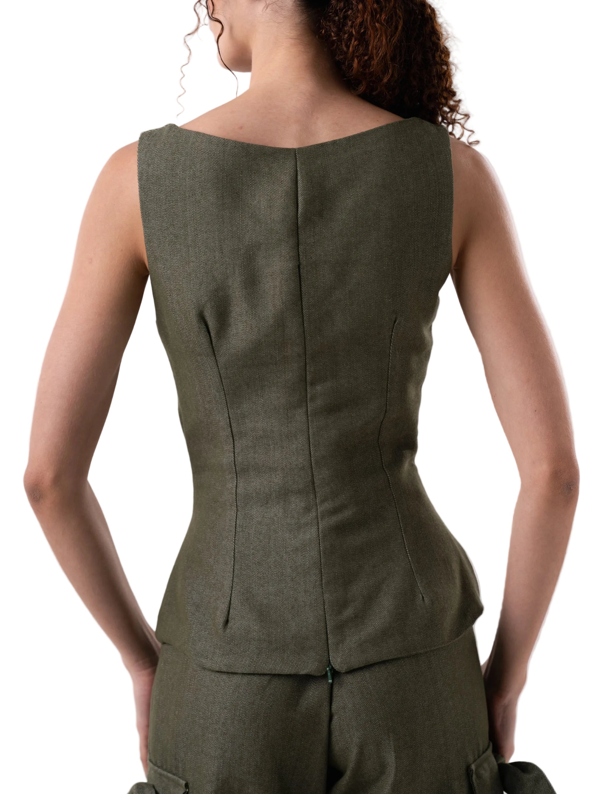 Sleeveless vest like top, with fitted silhouette, petal knot detail down the front and back zipper closure.