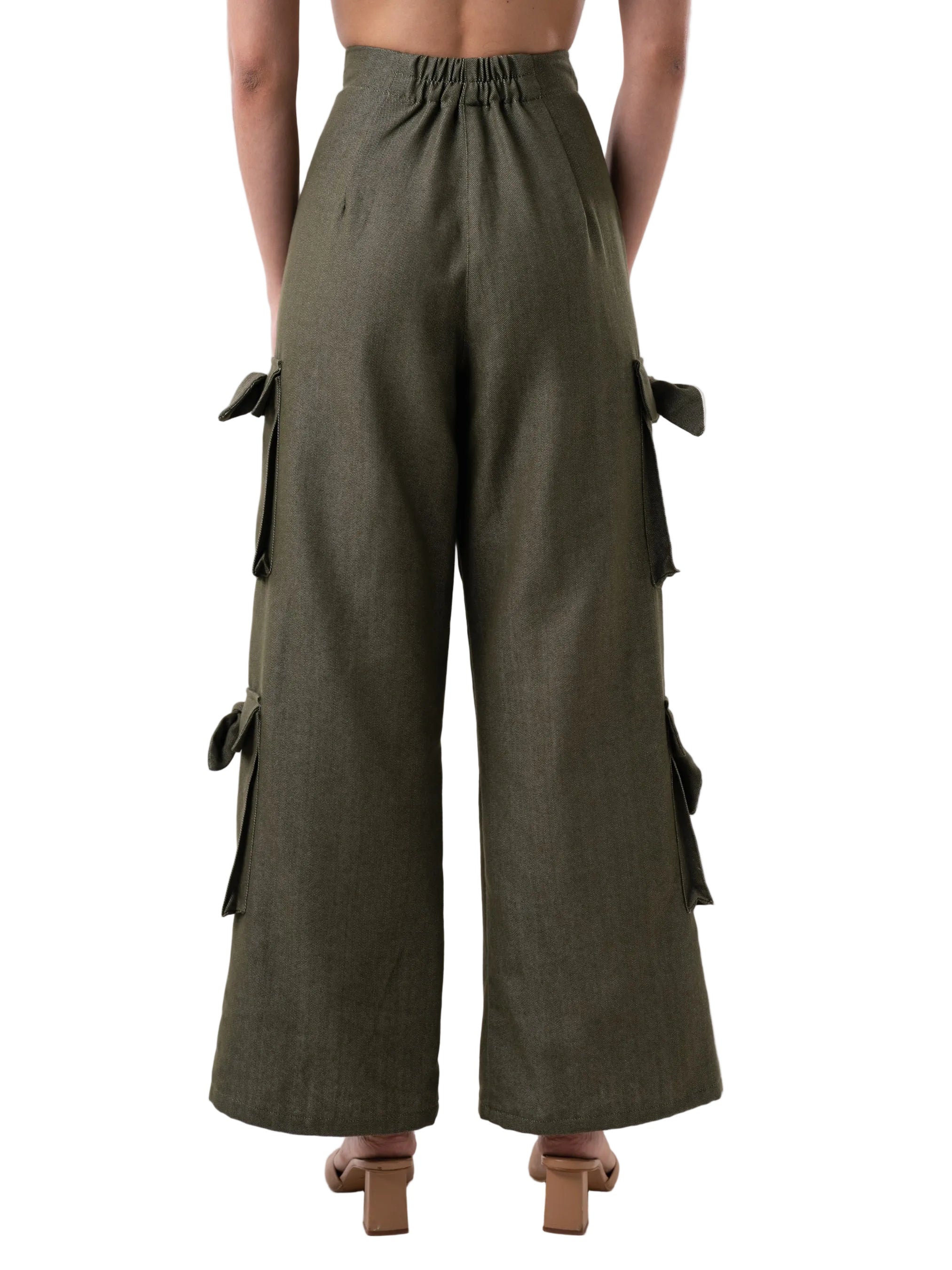  Pant that features a high waisted cargo style, front zipper, oversized pockets down the leg with knot details, comes with matching strap for styling at the ankle.