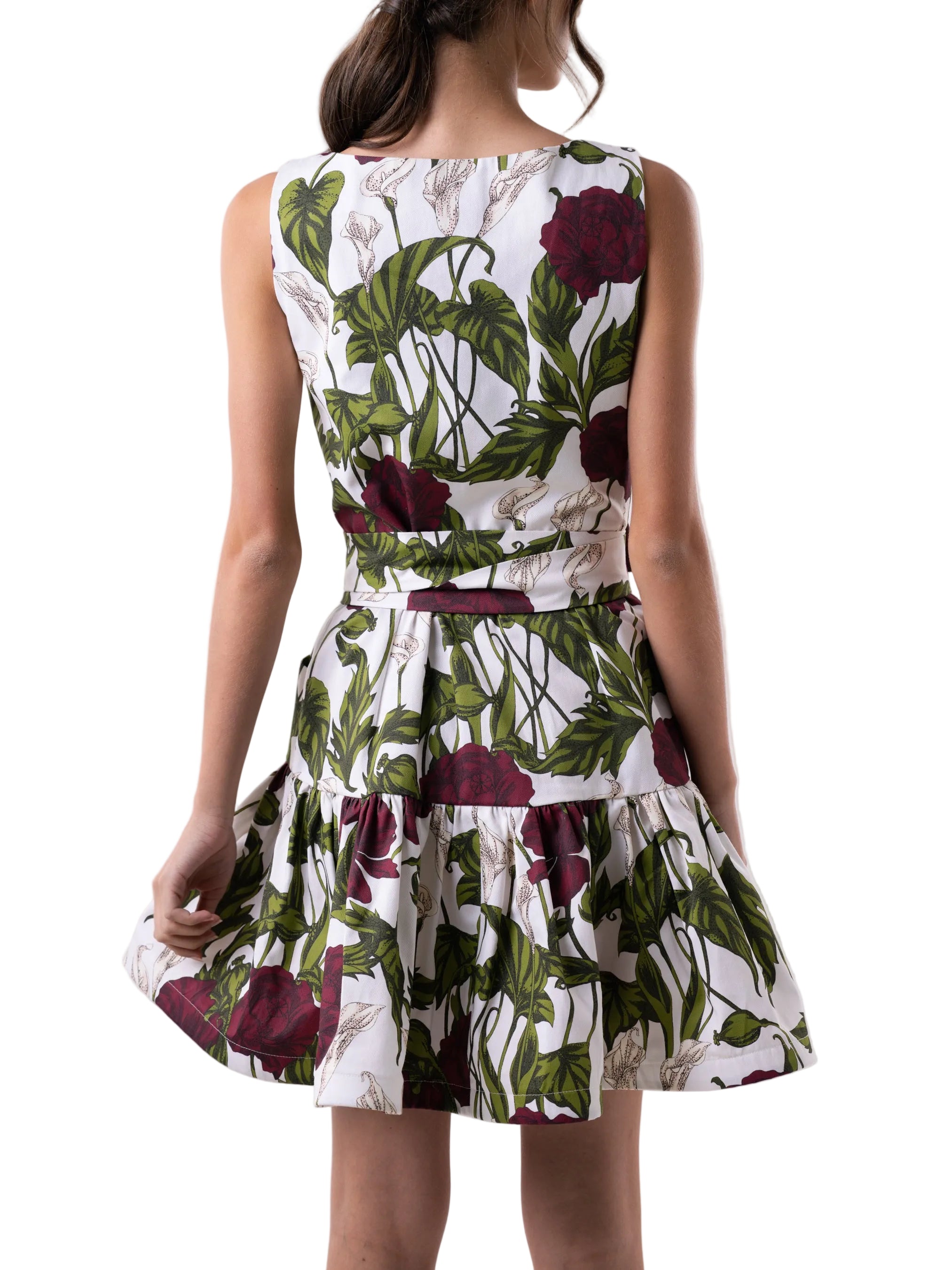 Dress features a square neck, above the knee length, sleeveless dress with front button down closure and gathered skirt. 