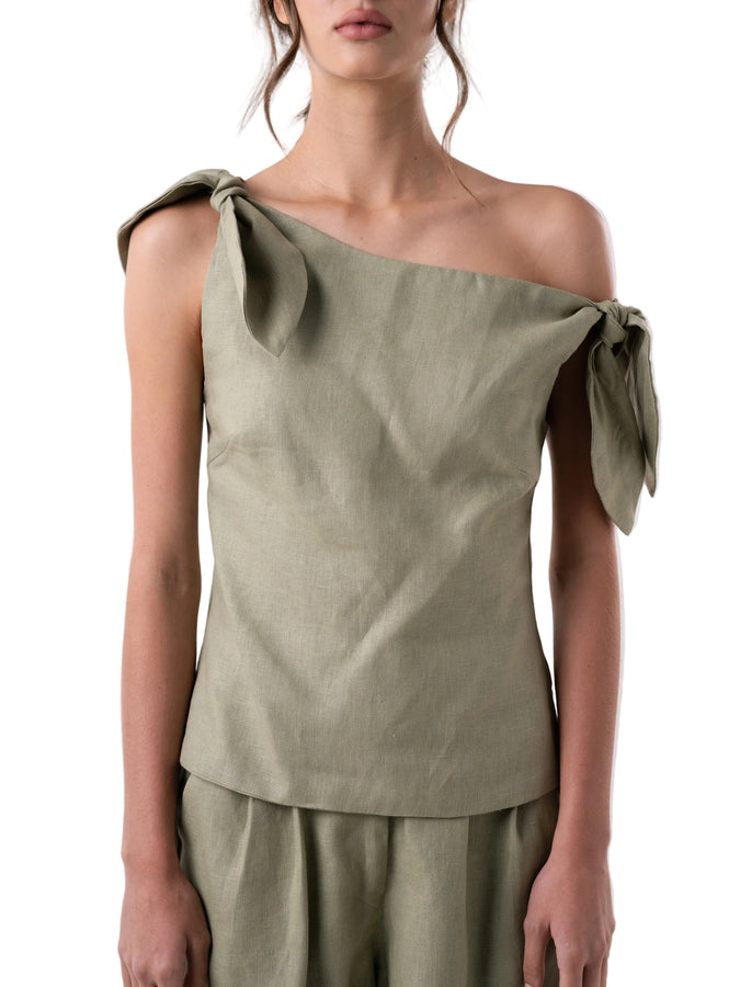 Top features a relaxed drop waist silhouette with single drop shoulder and petal knot detail.