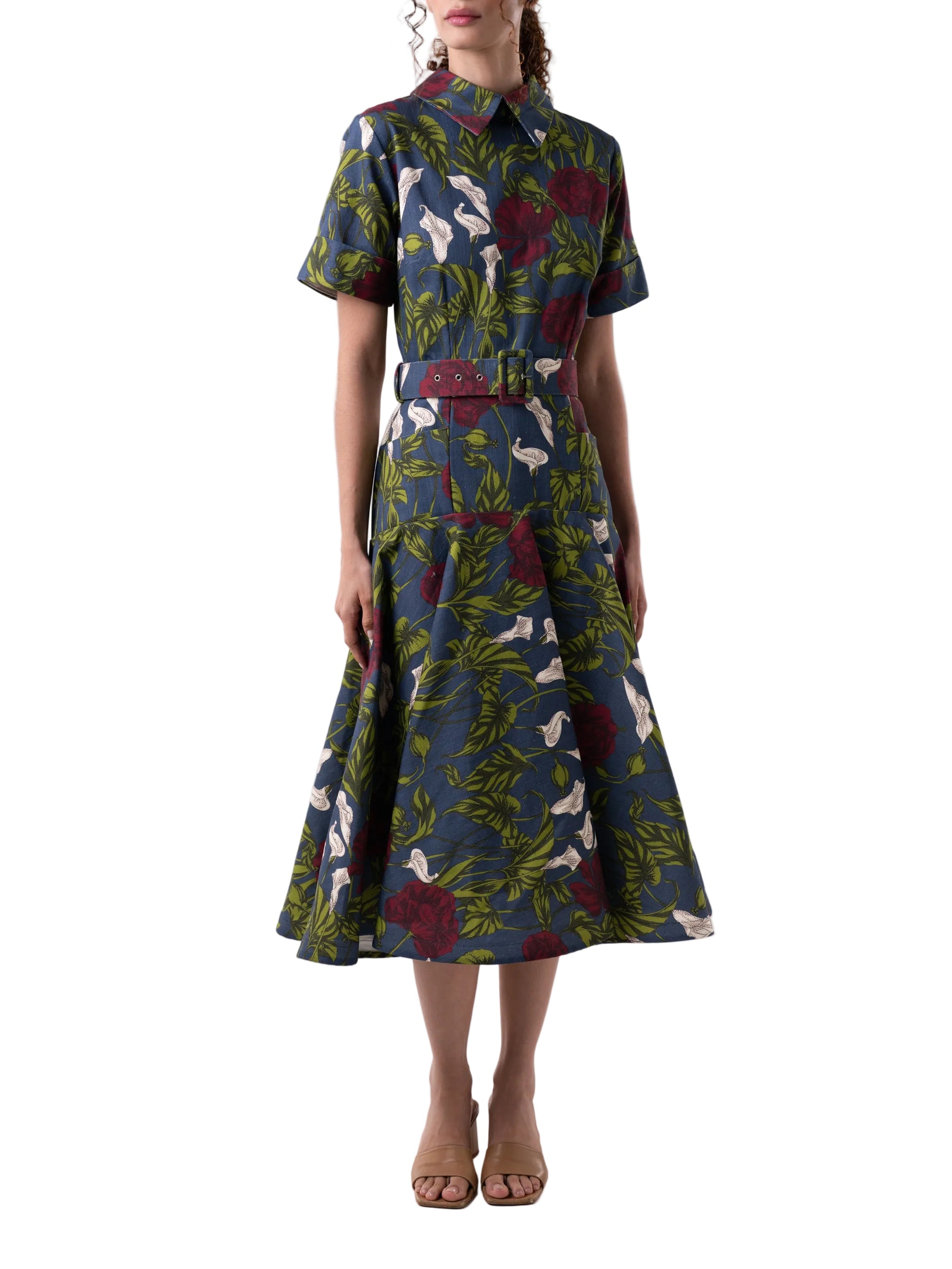 Dress that features a fit and flare silhouette, short sleeves with cuff detail, classic collar and back zipper closure.