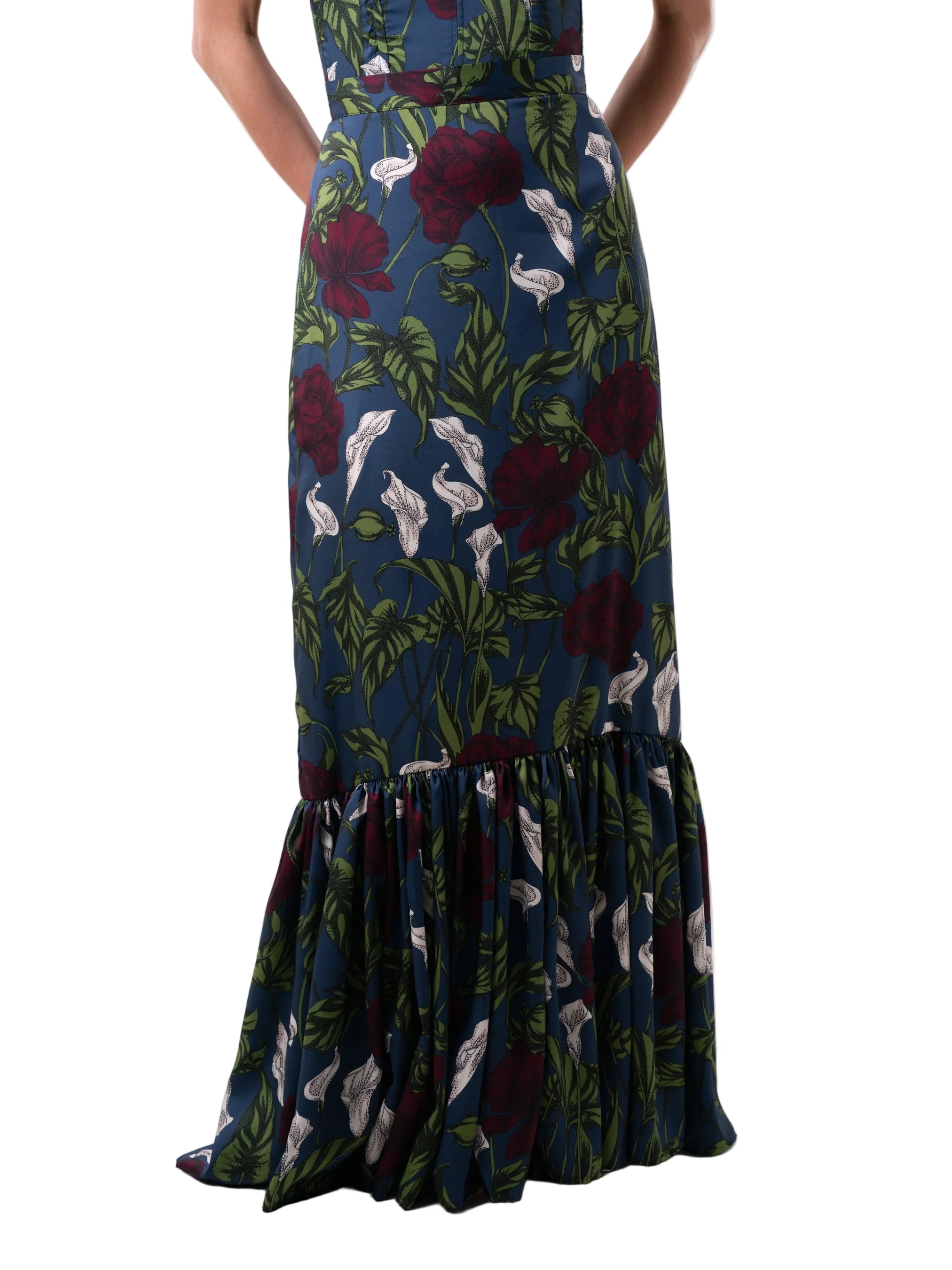 Skirt that features a high waisted soft A line silhouette finished with a gathered panel below the knee and back zipper closure.