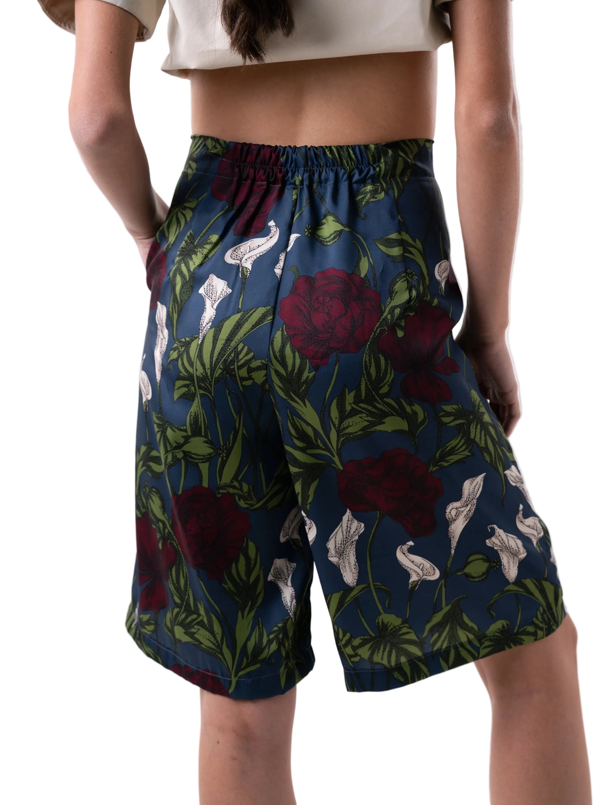 Bermudas that feature a high waisted silhouette with front pleats, and wide leg cut.