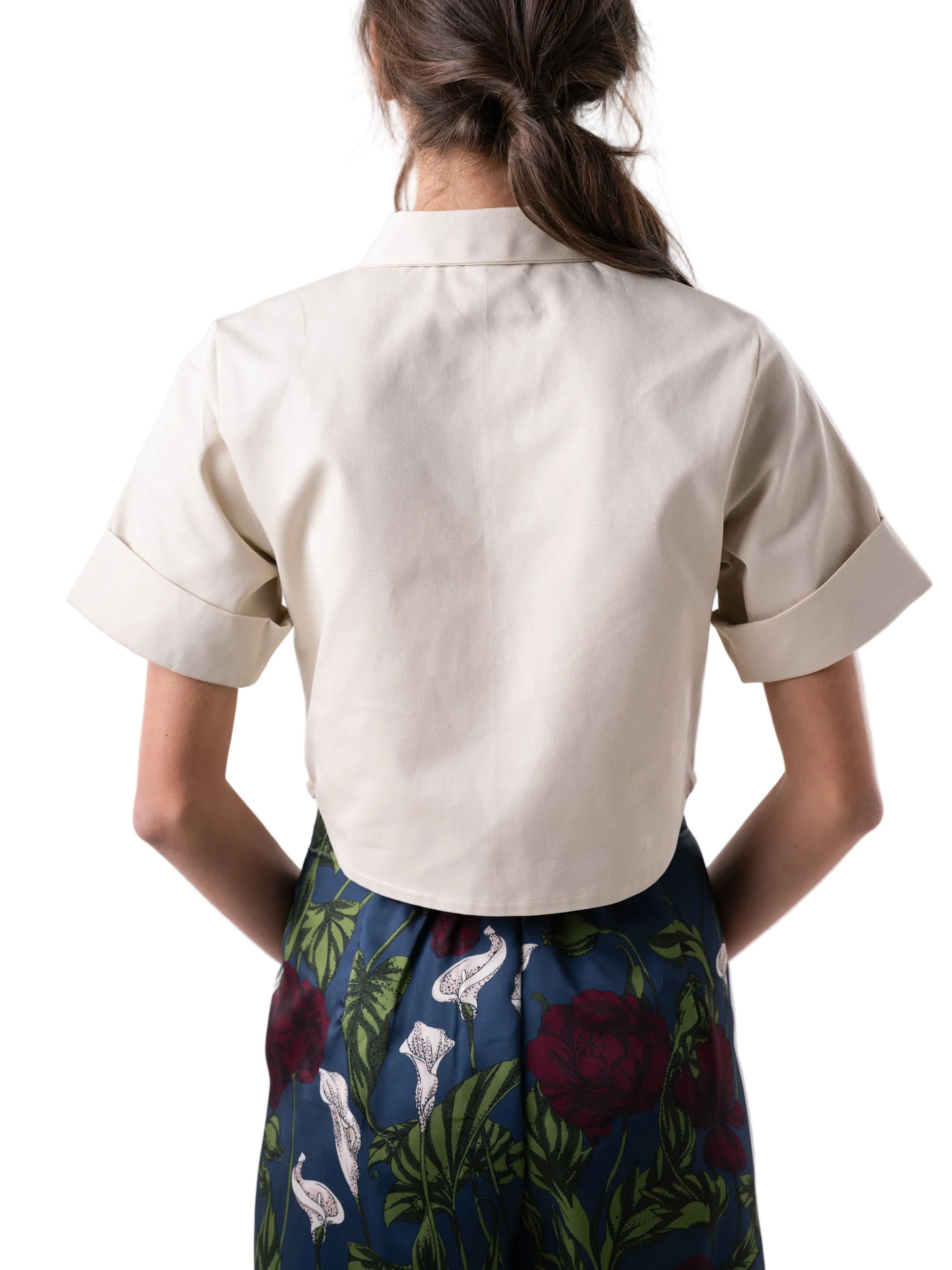 Short sleeve classic button down top, with a cropped silhouette, cuff detail and floral motif embroidery.