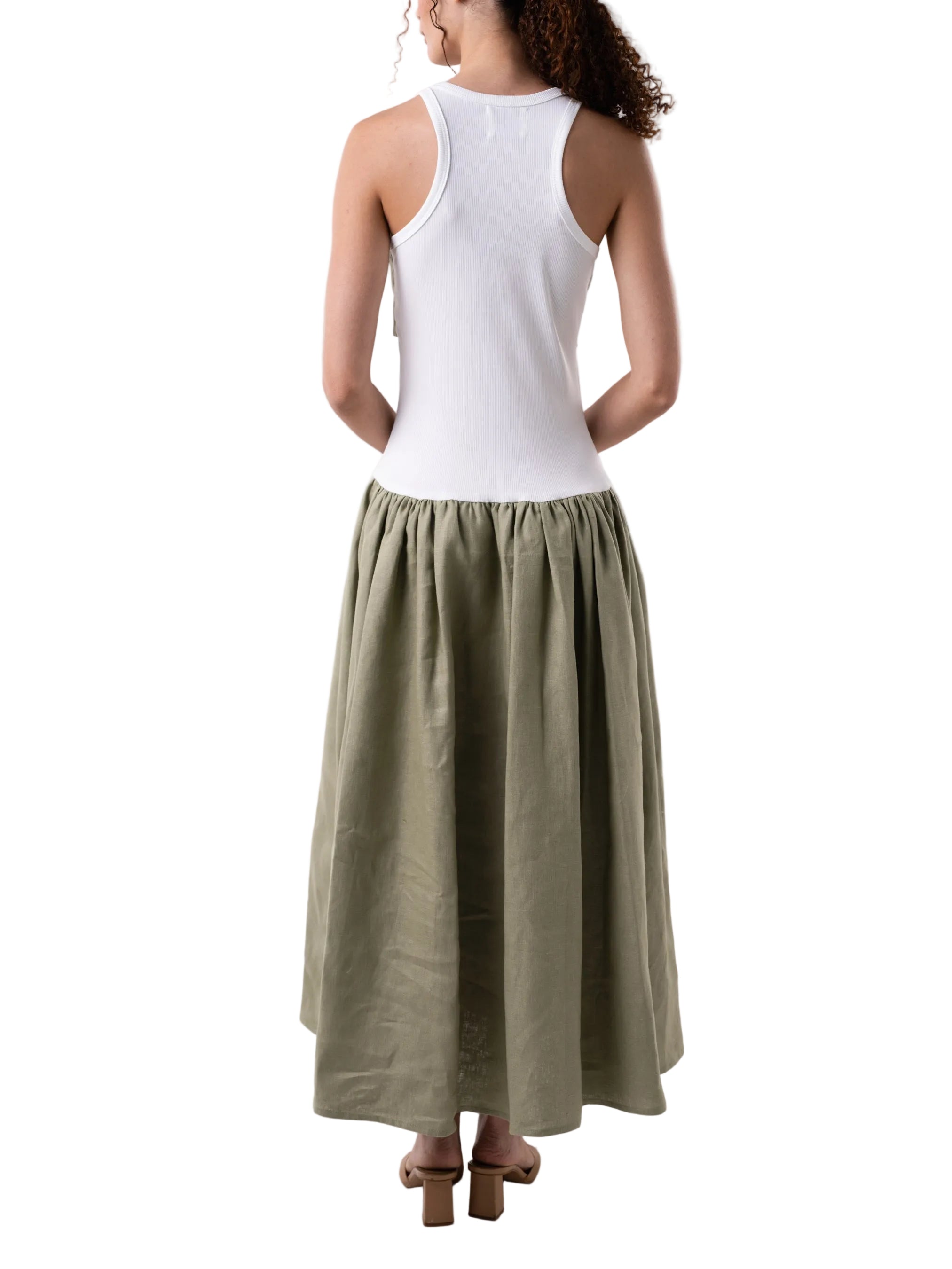 Dress that features a fitted knit silhouette with contrasting fabric gathered panel skirt, below the knee length and oversized knot detail at the chest.